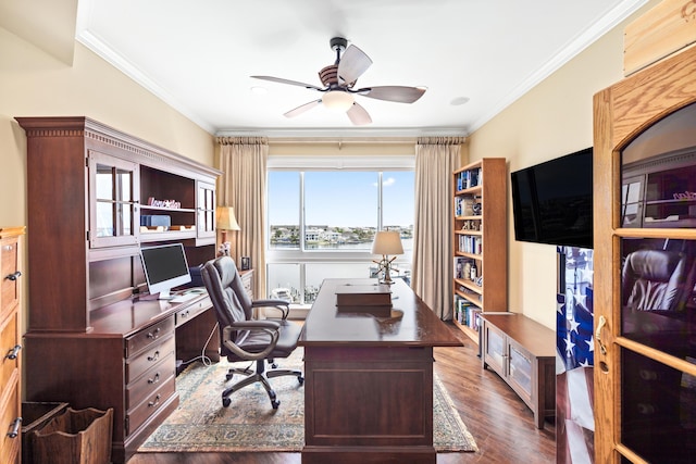 office space with dark wood-type flooring, ceiling fan, and ornamental molding