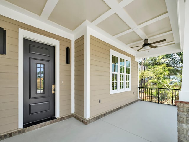 doorway to property with ceiling fan