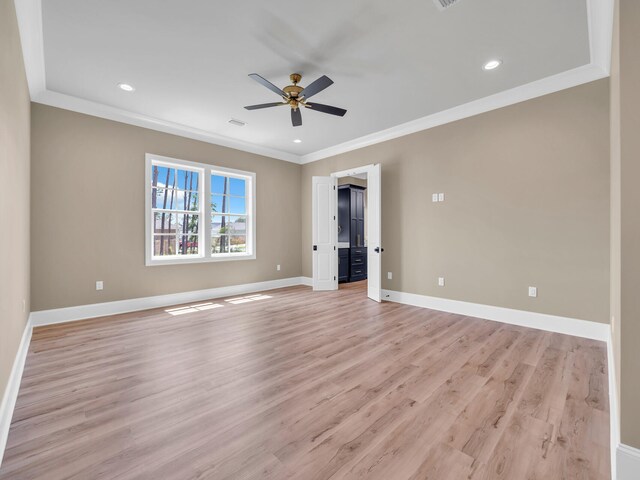 interior space with ornamental molding, ceiling fan, and light hardwood / wood-style floors