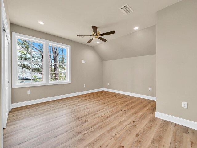 bonus room featuring ceiling fan, light wood-type flooring, and lofted ceiling