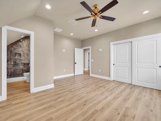 interior space with ceiling fan, light wood-type flooring, and vaulted ceiling