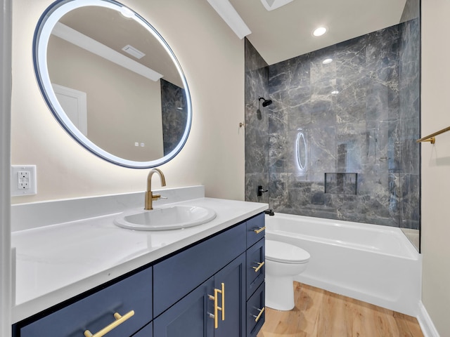 bathroom featuring recessed lighting, toilet, vanity, shower / tub combination, and wood finished floors