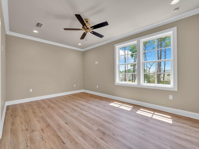 spare room featuring ceiling fan, light hardwood / wood-style flooring, and ornamental molding