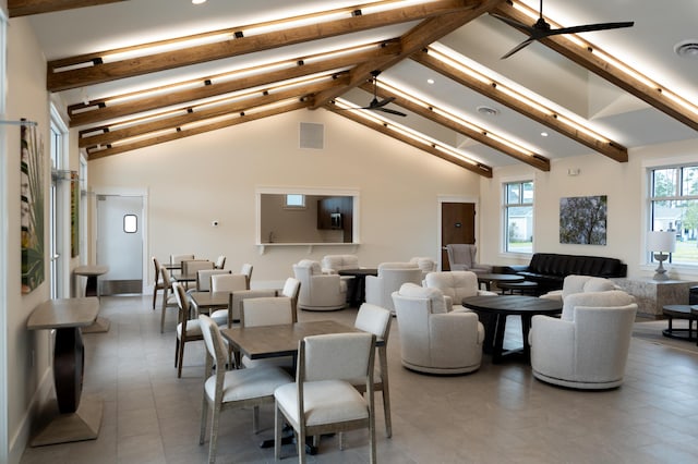 dining room with high vaulted ceiling, beam ceiling, and ceiling fan