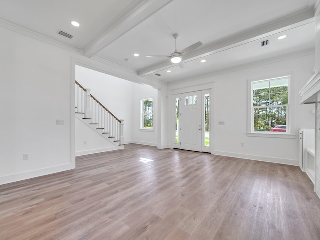 foyer featuring beam ceiling, wood-type flooring, ornamental molding, and ceiling fan