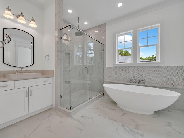 bathroom with vanity, crown molding, tile patterned flooring, and independent shower and bath