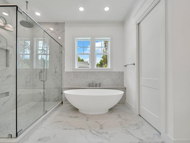 bathroom featuring an enclosed shower, ornamental molding, and tile patterned floors