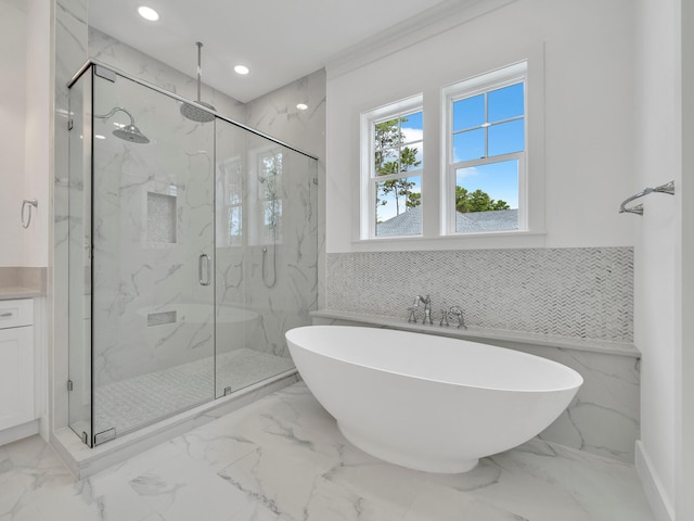 bathroom with vanity, plus walk in shower, tile patterned flooring, and tile walls