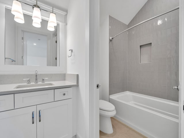 full bathroom featuring lofted ceiling, tile patterned floors, toilet, vanity, and tiled shower / bath combo