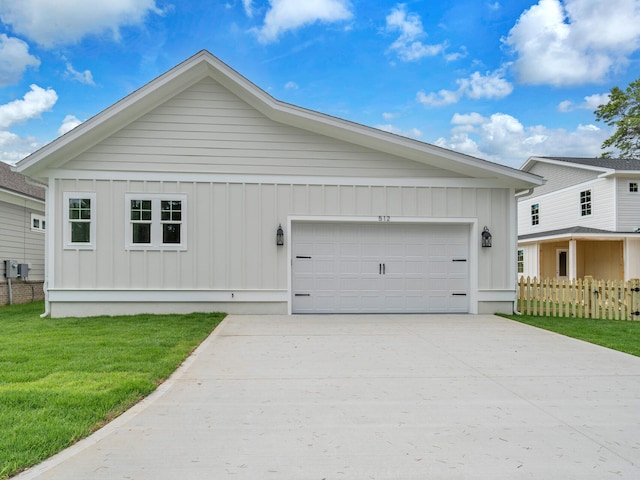 view of front facade with a garage and a front yard