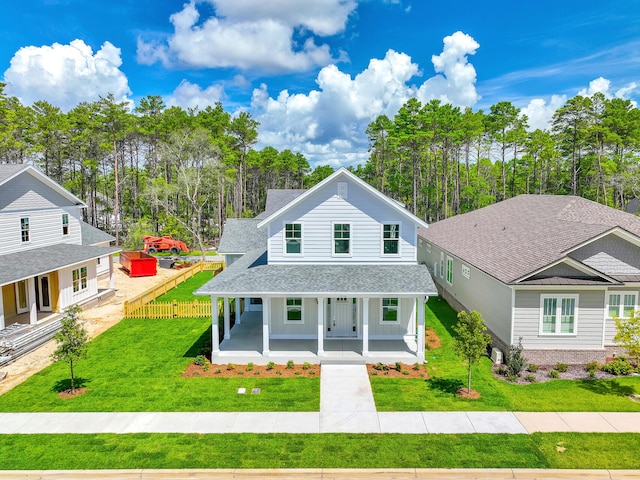 view of front of home with a porch and a front lawn