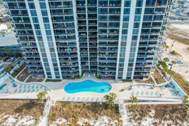 view of property featuring a community pool