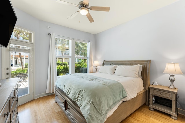 bedroom with ceiling fan, light hardwood / wood-style floors, and access to exterior