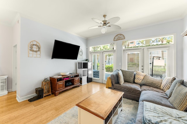 living room with ceiling fan, french doors, crown molding, and hardwood / wood-style flooring