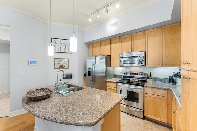 kitchen with stainless steel appliances, crown molding, sink, a center island with sink, and stone counters