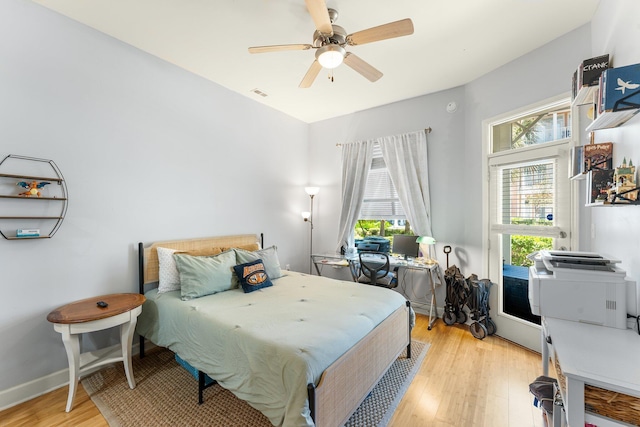 bedroom with ceiling fan and light hardwood / wood-style floors