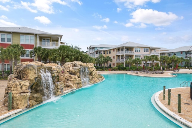 view of swimming pool featuring pool water feature