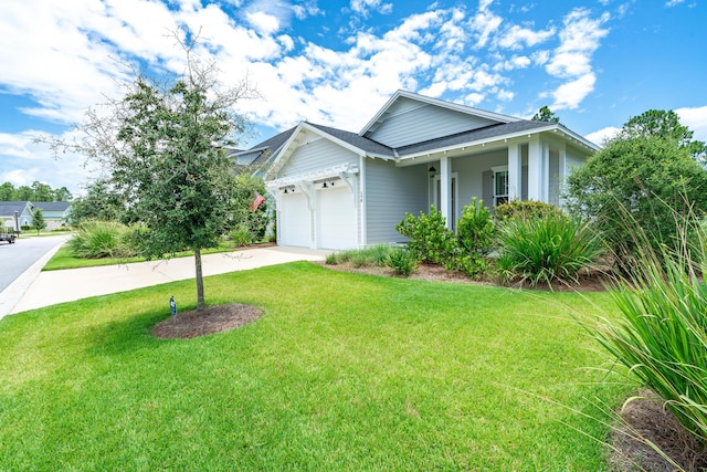 view of front of home featuring a garage and a front yard