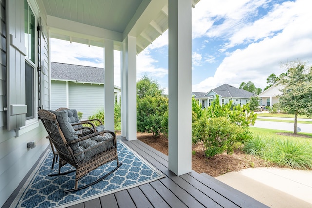 wooden terrace with a porch