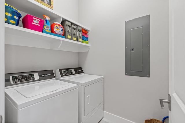 clothes washing area featuring independent washer and dryer and electric panel