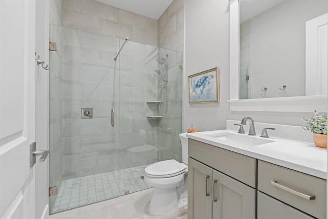 bathroom with vanity, toilet, and walk in shower