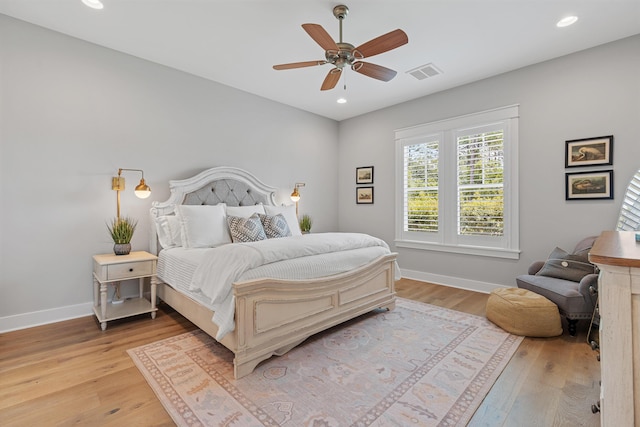 bedroom with ceiling fan and light wood-type flooring