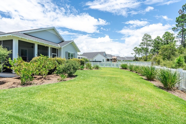 view of yard with a sunroom