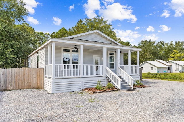 view of front facade with ceiling fan and a porch