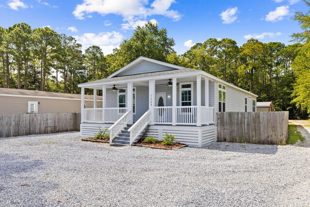 view of front of home featuring ceiling fan and covered porch