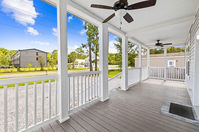 wooden deck with ceiling fan and a porch