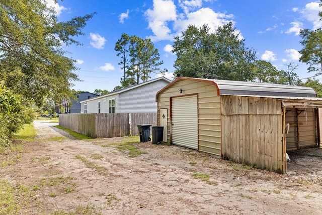 view of outbuilding with a garage