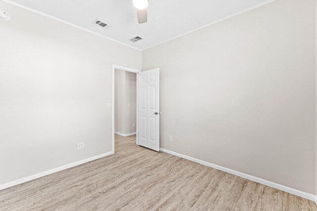 empty room featuring ceiling fan and light wood-type flooring