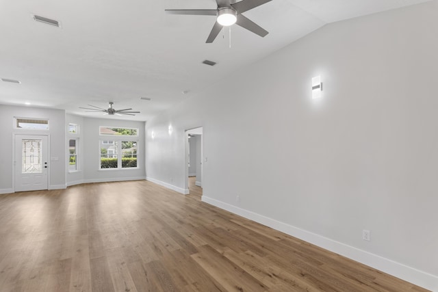 unfurnished living room with ceiling fan and hardwood / wood-style floors