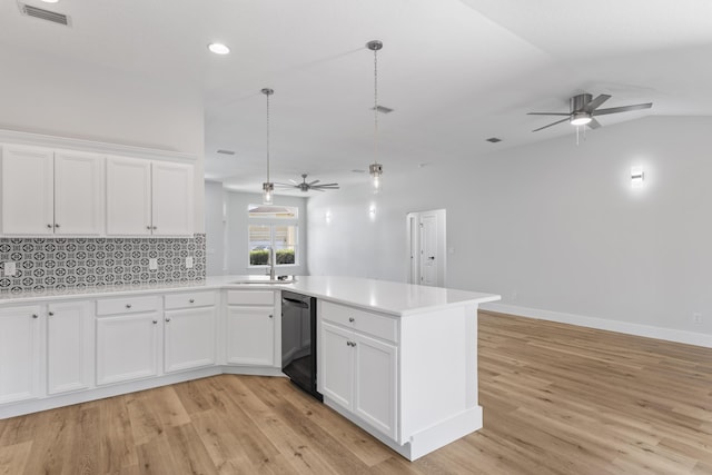 kitchen with white cabinetry, pendant lighting, and black dishwasher