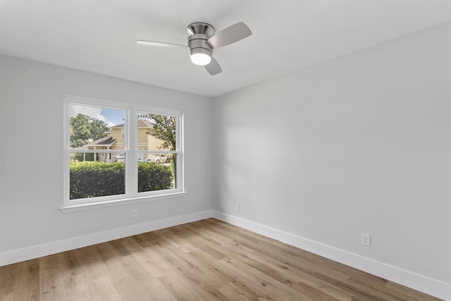 spare room with ceiling fan and light hardwood / wood-style floors