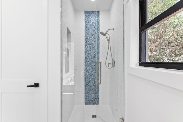 bathroom featuring an enclosed shower