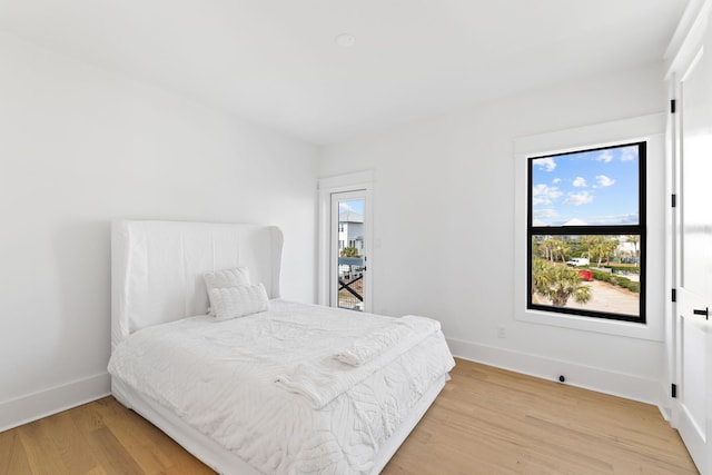 bedroom with light hardwood / wood-style flooring