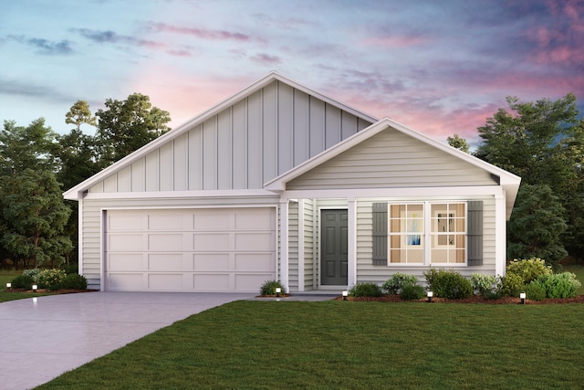 view of front of property featuring a garage and a yard