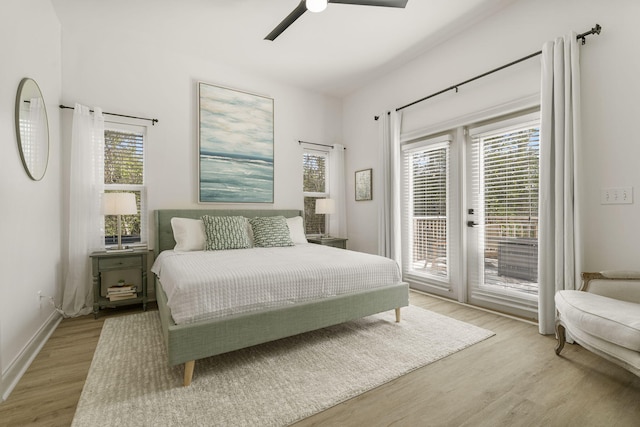 bedroom with access to exterior, light hardwood / wood-style floors, and ceiling fan