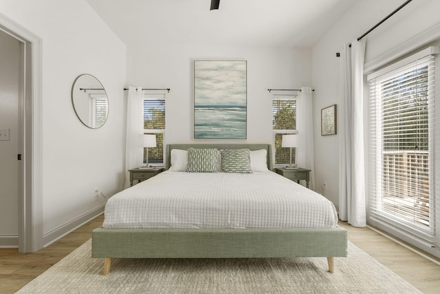 bedroom featuring ceiling fan and light wood-type flooring