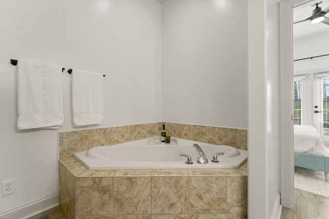 bathroom featuring tiled tub