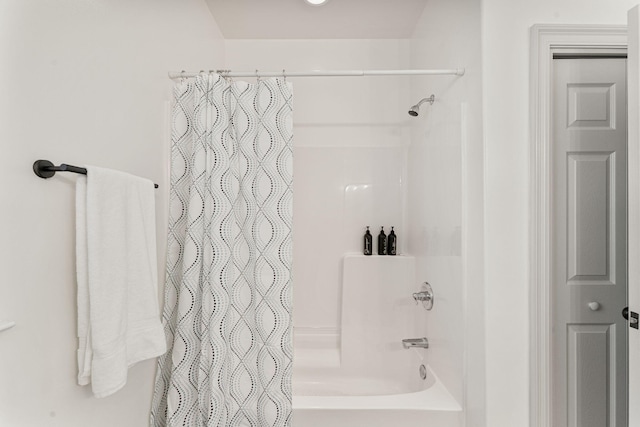 bathroom with shower / tub combo with curtain