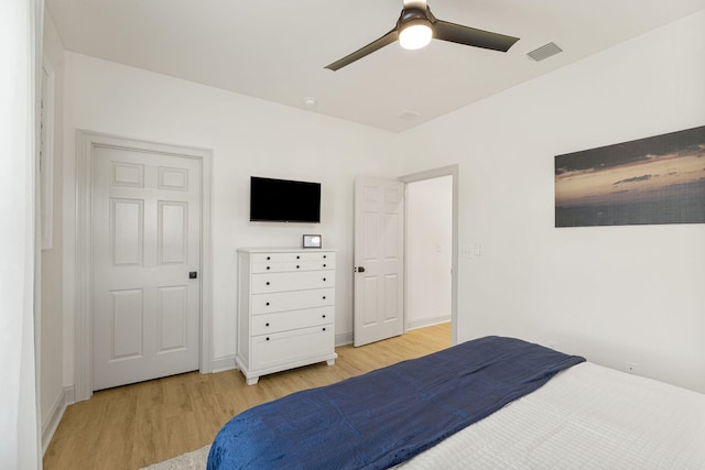 bedroom featuring light hardwood / wood-style flooring and ceiling fan