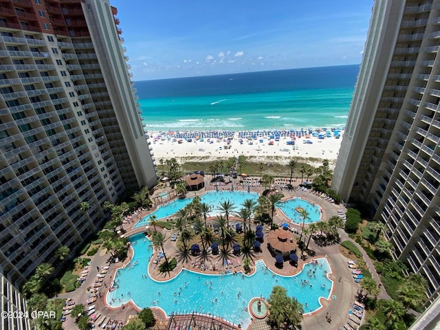 exterior space featuring a beach view and a water view