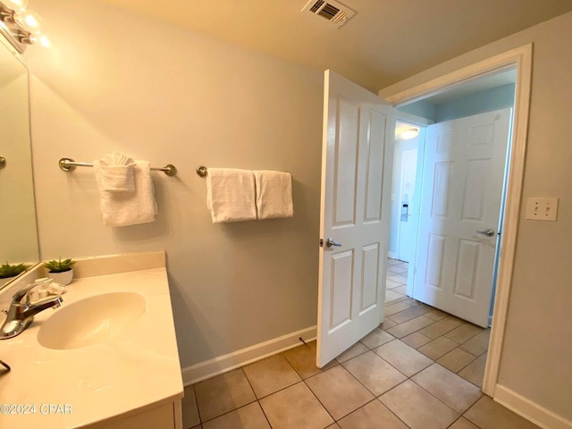 bathroom featuring tile patterned floors and vanity