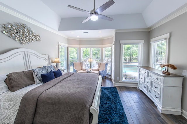 bedroom featuring ceiling fan, vaulted ceiling, ornamental molding, and dark hardwood / wood-style flooring