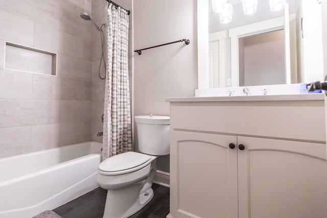 full bathroom featuring shower / tub combo with curtain, vanity, toilet, and wood finished floors