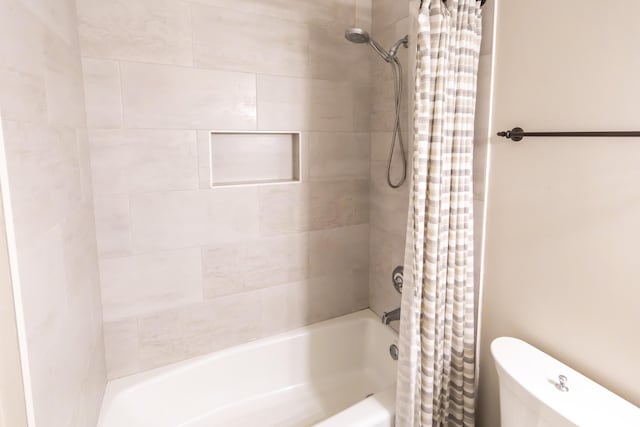 full bath with shower / tub combo and toilet