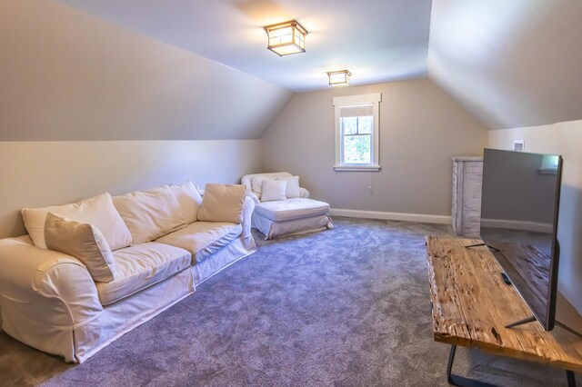 interior space featuring lofted ceiling and carpet