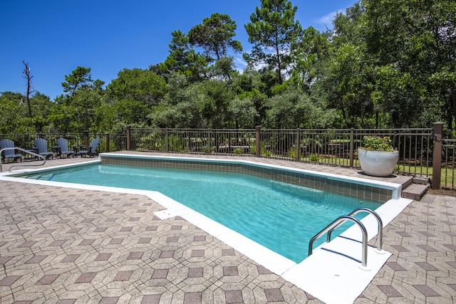 view of pool with fence and a fenced in pool